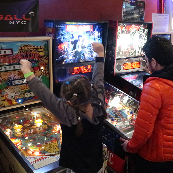 boy playing at modern pinball nyc