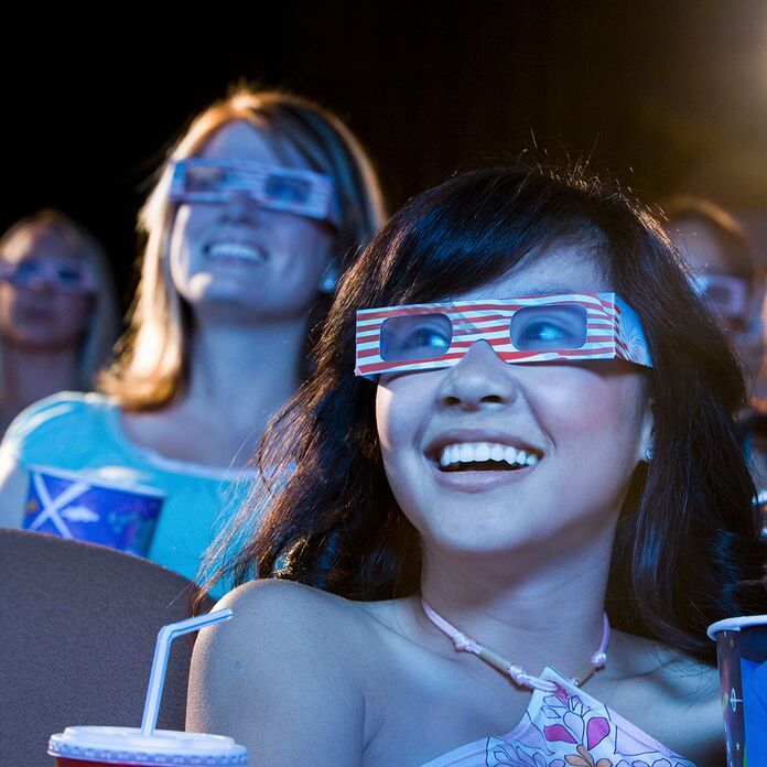 Women watching a movie with 3D glasses