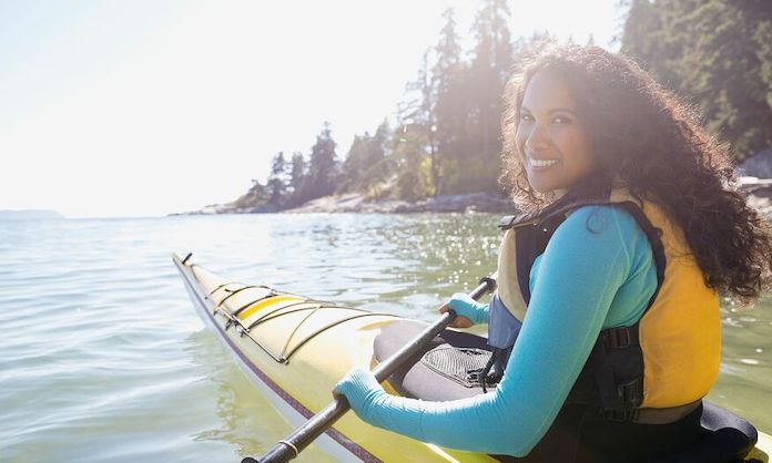 Woman kayaking in Michigan
