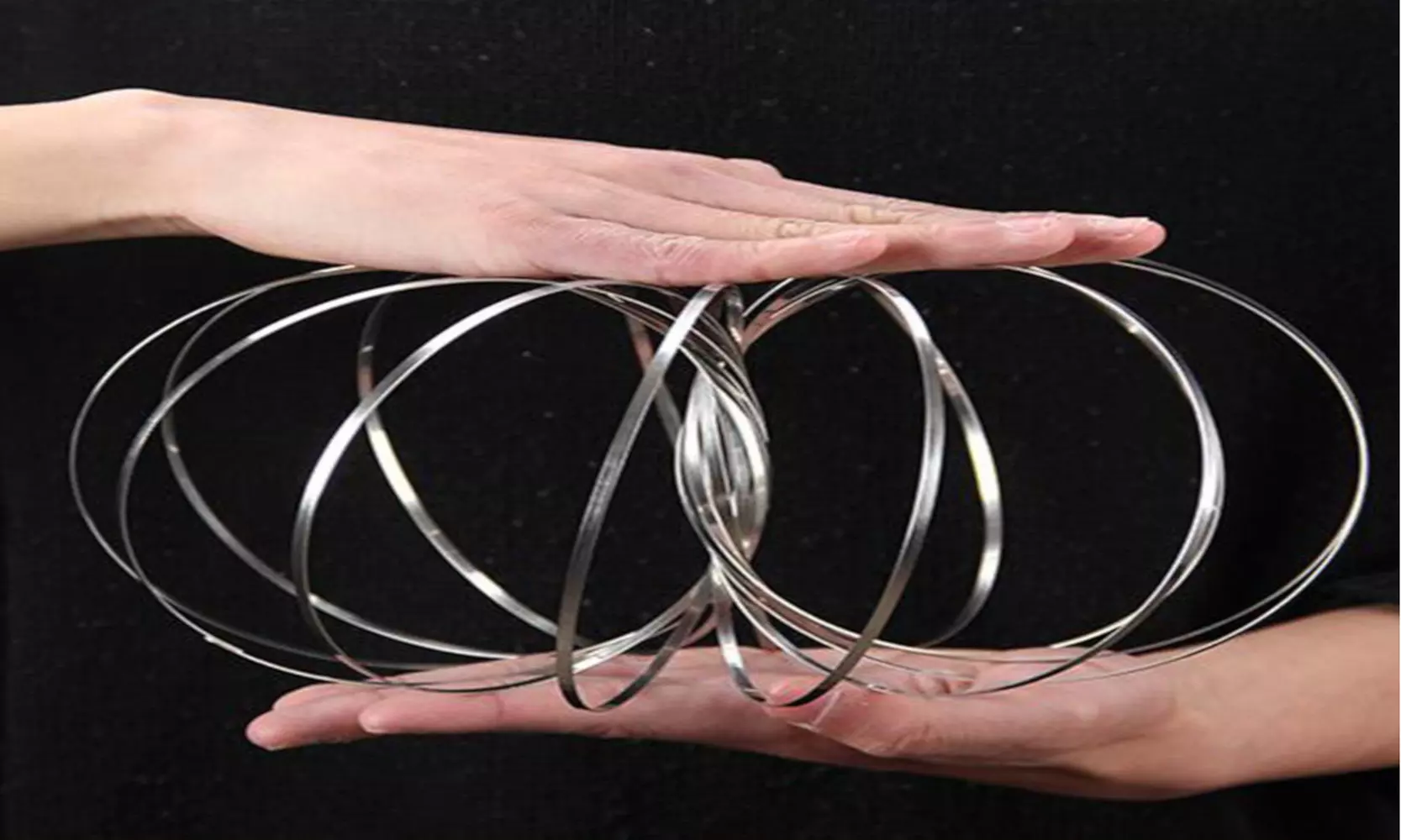 NEW! Magic Flow Ring Slinky 3D Fun Kinetic Spring Infinity Arm Juggle Toys US - Second Medium