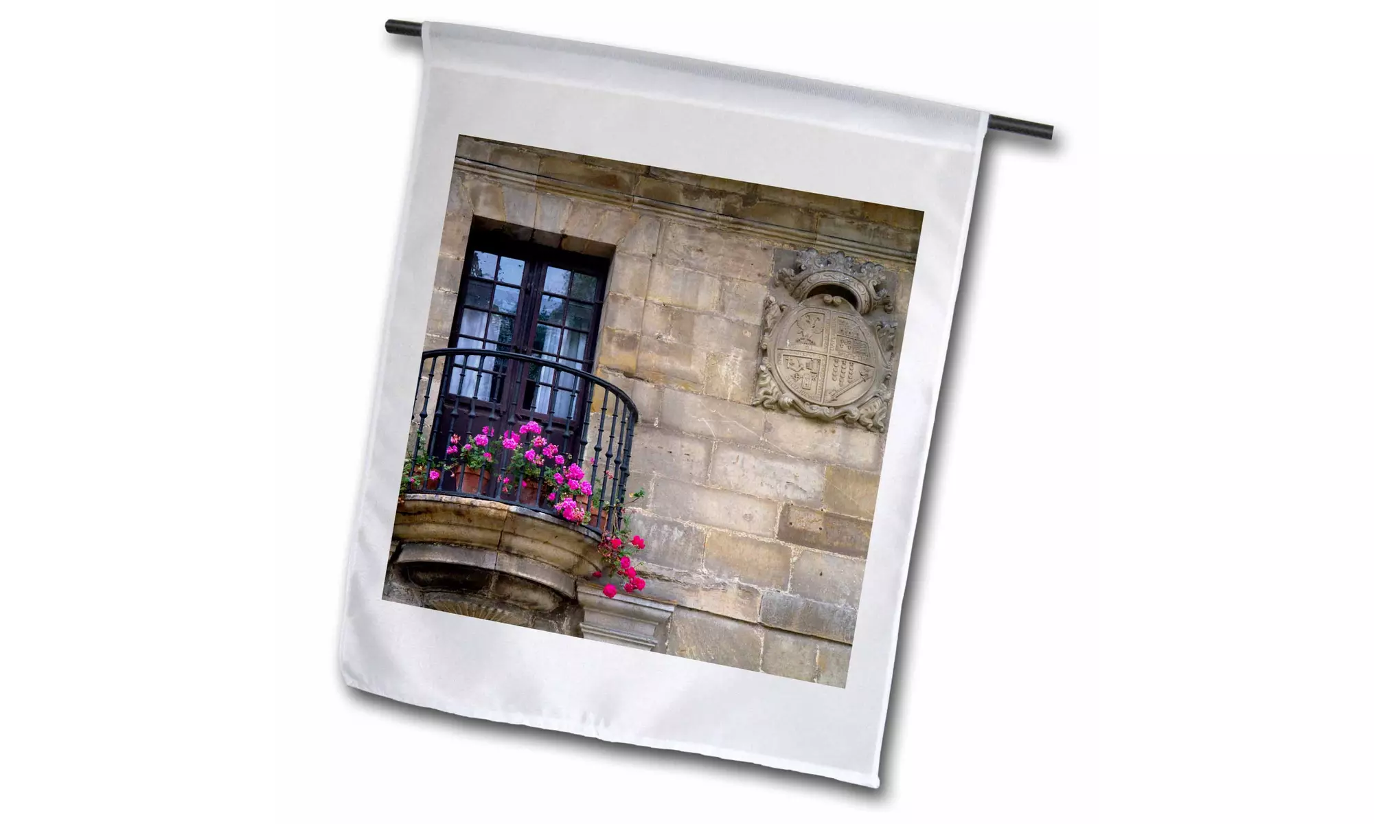 Garden Flag Coat of arms in a stone wall at Santillana del Mar Cantabria, Spain - Primary Image