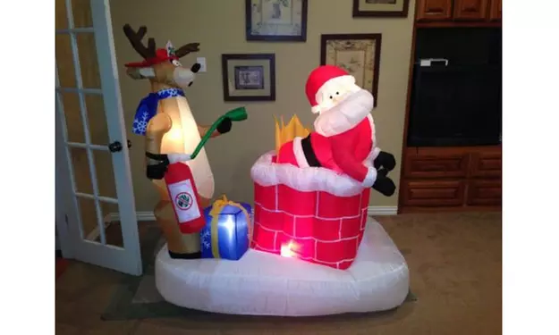 New High Quality 4 ft. Santa in Chimney on Fire Funny Christmas Inflatable - Primary Image