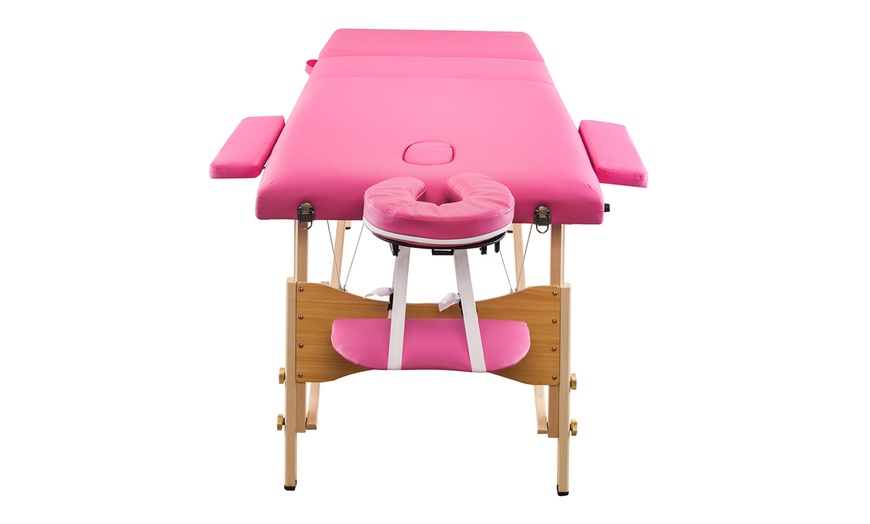 pink massage table with stool