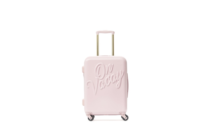 on vacay suitcase pink