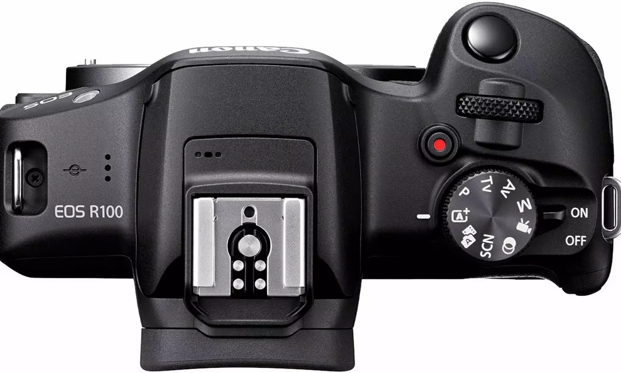 Canon EOS R100 Camera with 18-45mm Lens, Bag, 64GB Card, Battery, Tripod, & More