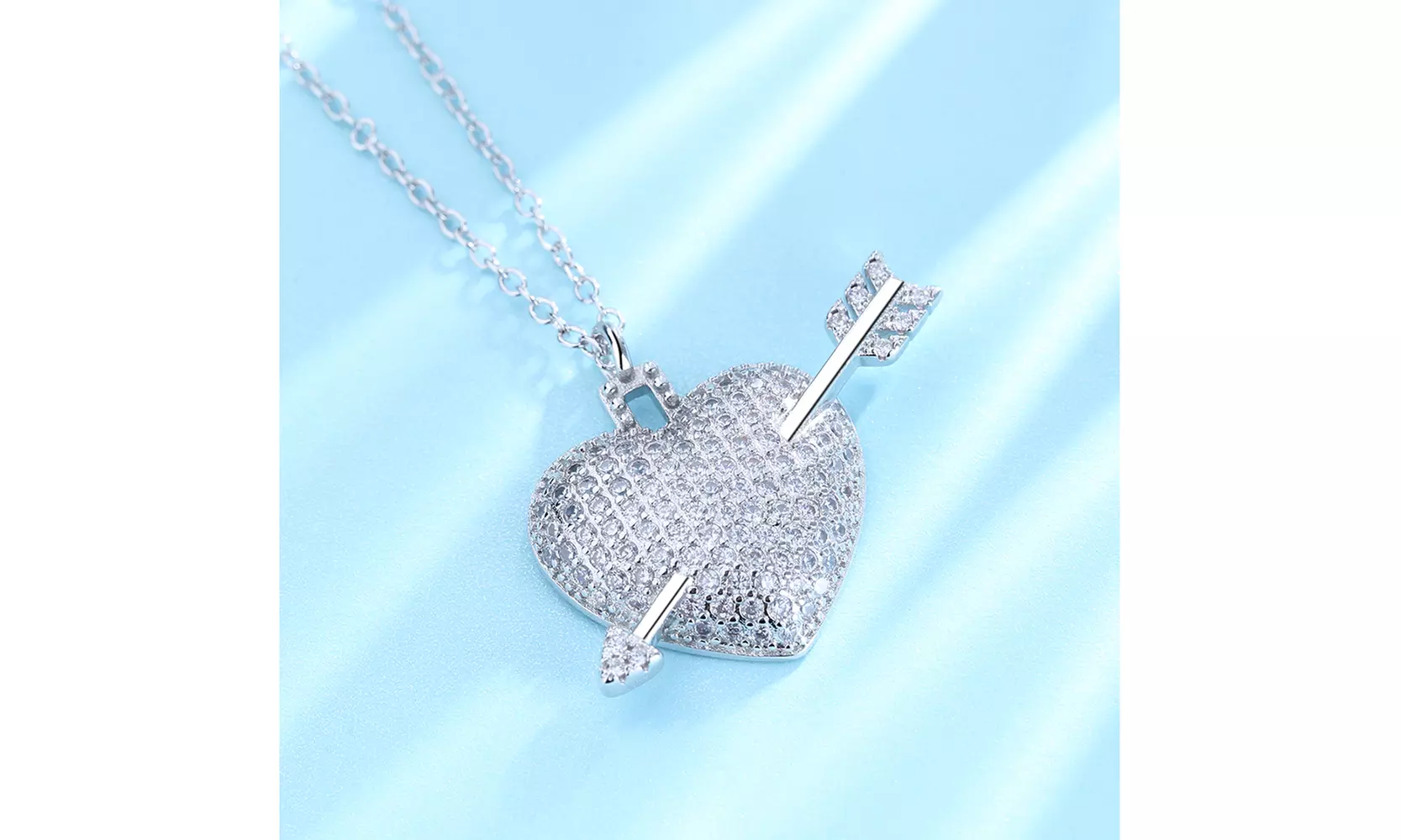 18 Karat White Gold Plated Shot through the Heart with Genuine Crystals