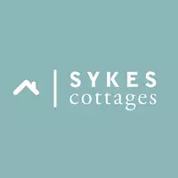 Sykes Cottages - Logo